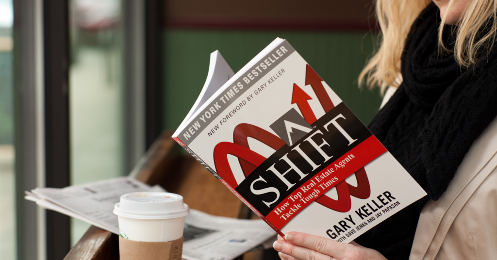woman in coffee shop reading the book SHIFT by Gary Keller