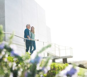 couple on a large porch overlooking the scenery