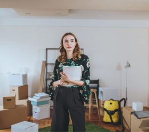 woman in an empty house looking into the distance