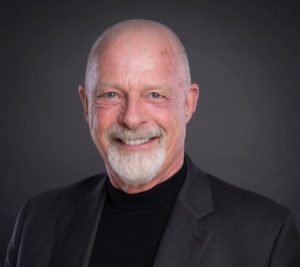 portrait of Millionaire Real Estate Agent co-author Dave Jenks